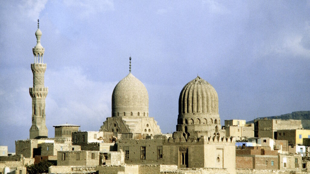 Historic mosques and domes rising above the skyline of Cairo, Egypt.