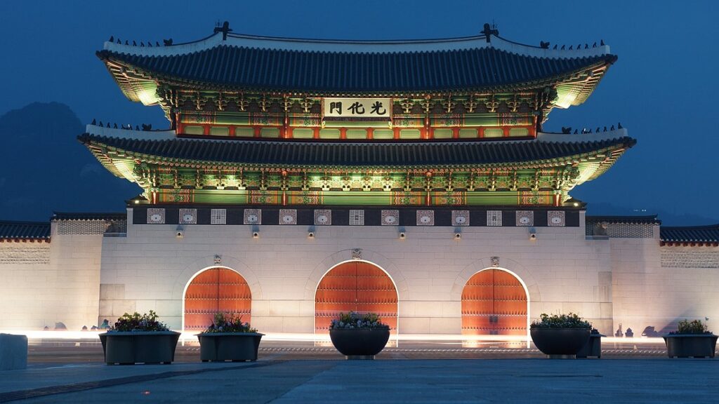 Gwanghwamun Gate illuminated at night in Seoul South Korea traditional palace entrance.