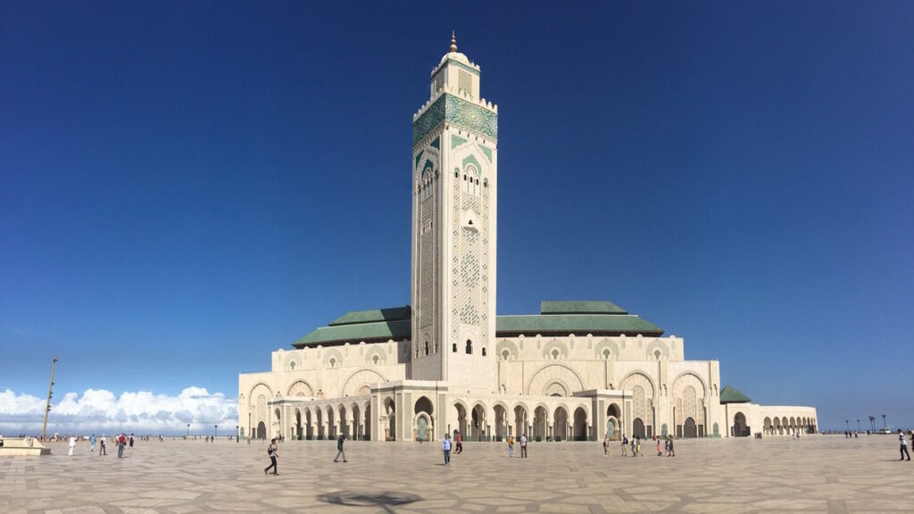 Hassan II Mosque in Casablanca Morocco with large courtyard and minaret.