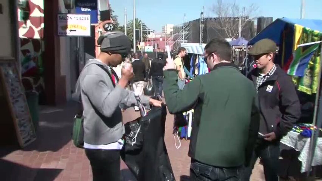 People shopping at an outdoor street market in Johannesburg South Africa
