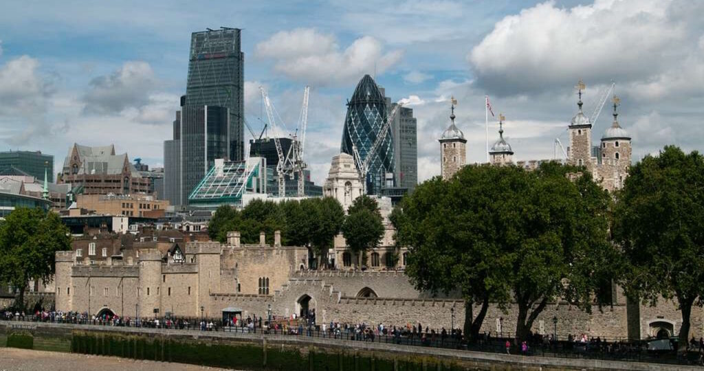 Tower of London with the modern London skyline and the Gherkin skyscraper in the background.