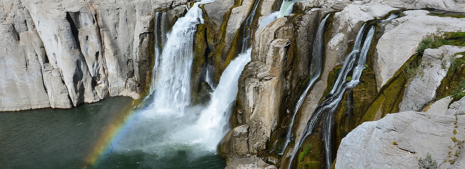 Scenic waterfall landscape representing travel destinations across North America.