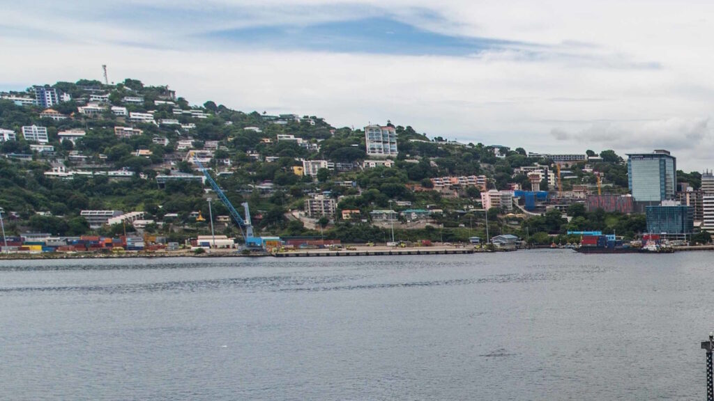 Port Moresby harbor with hillside city buildings in Papua New Guinea.