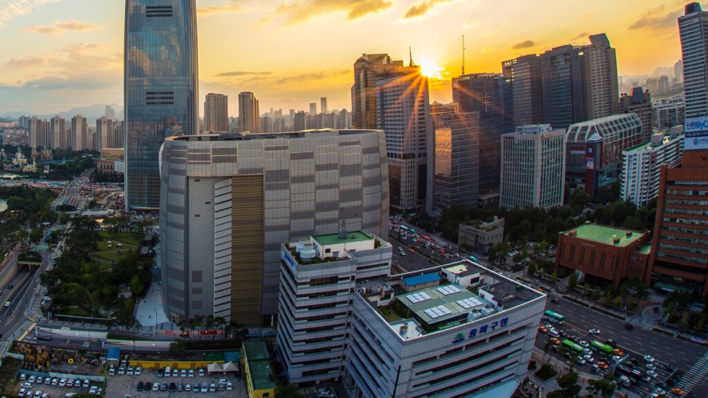 Skyline of Seoul South Korea with modern skyscrapers and river at sunset.