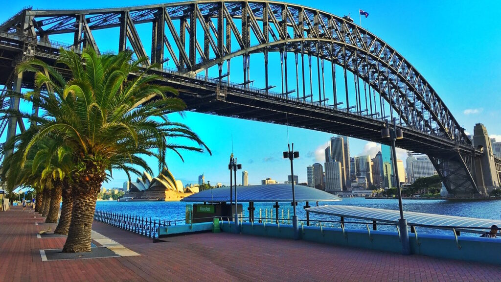 Sydney Harbour Bridge with Sydney Opera House and skyline in Australia.