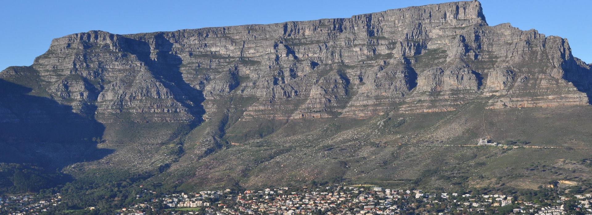 Table Mountain overlooking Cape Town South Africa with city below.