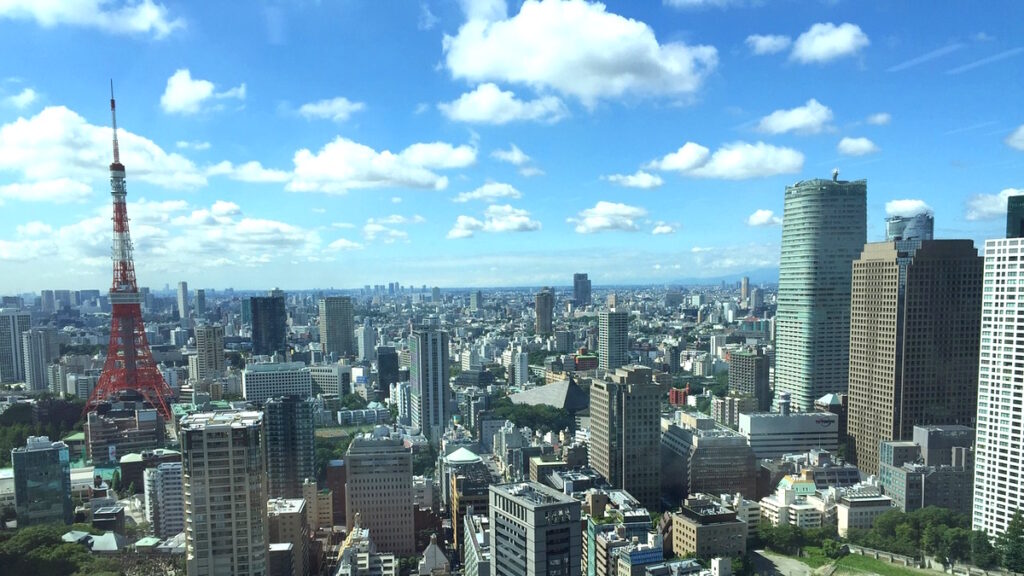 Skyline of Tokyo Japan with Tokyo Tower rising above the modern city.